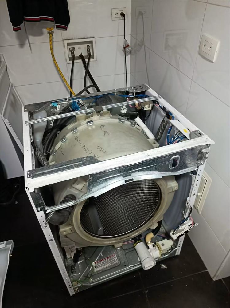 Lavadora desarmada para cambio de rodamientos